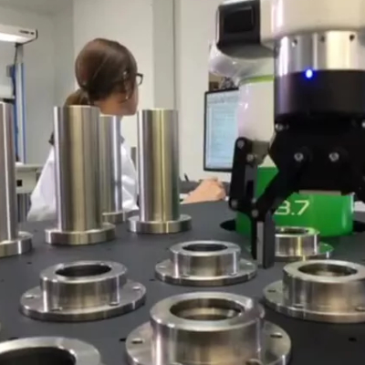 Image Showing The Manufacturing of Steel Flanges By Using Collaborative Robots.